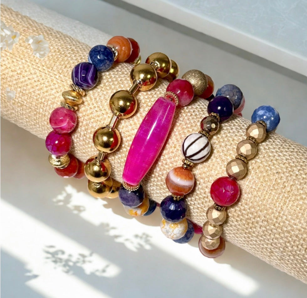 Colorful beaded bracelet on a textured surface