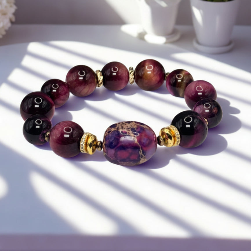 Purple beaded bracelet on a white surface with sunlight casting shadows
