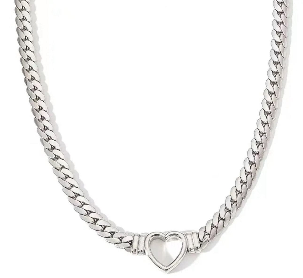 Silver herringbone chain necklace with a heart-shaped pendant on a white background
