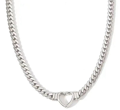 Silver herringbone chain necklace with a heart-shaped pendant on a white background