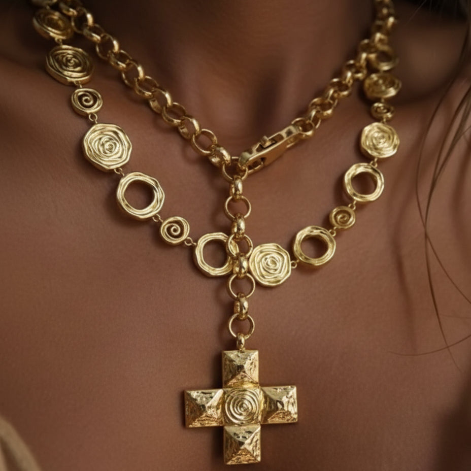 Gold necklace with a cross pendant on a female model