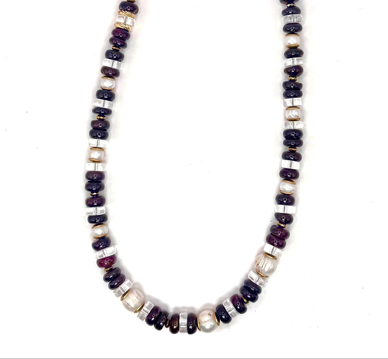 Beaded necklace with garnet and fresh water beads on a white background