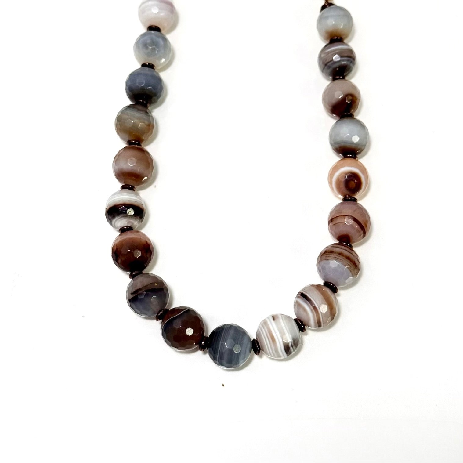 Necklace with multicolored beads on a white background