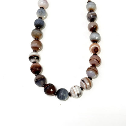 Necklace with multicolored beads on a white background