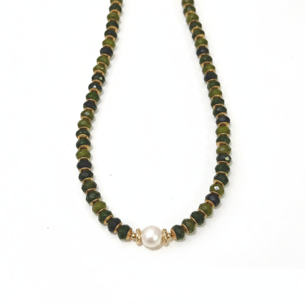 Necklace with olive green beads and a pearl pendant on a white background