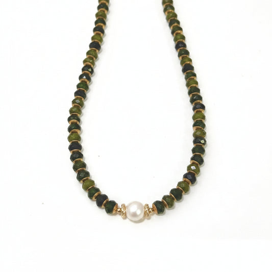 Necklace with olive green beads and a pearl pendant on a white background