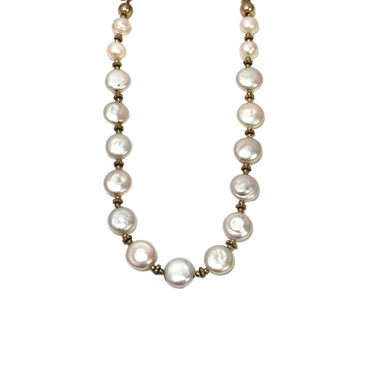 Coin pearl necklace with gold beads on a white background