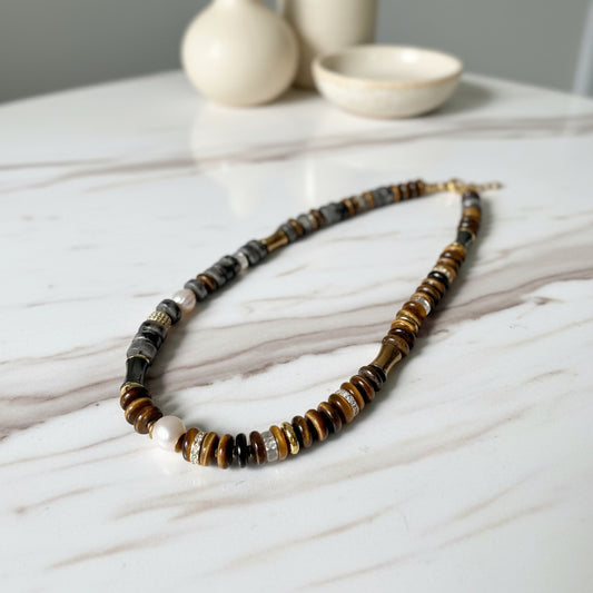 Necklace with multicolored beads on a white background