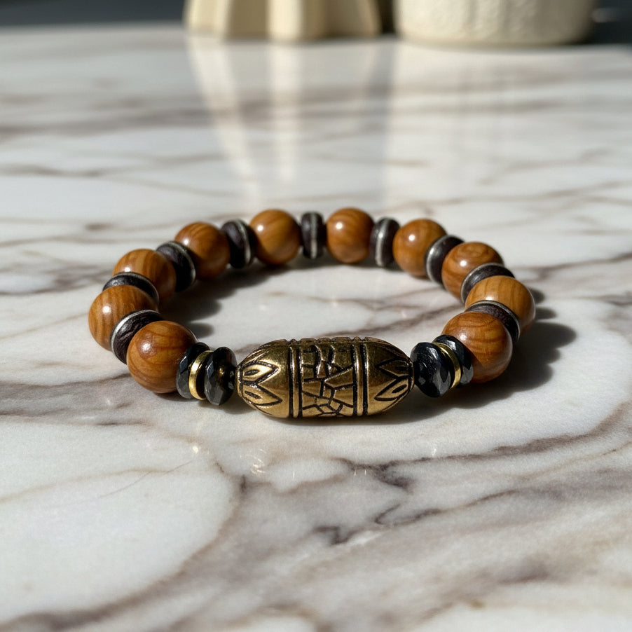 Wood jasper beaded bracelet with a large decorative bead on a white background