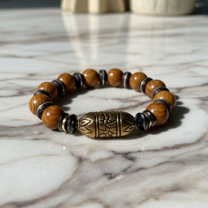 Wood jasper beaded bracelet with a large decorative bead on a white background