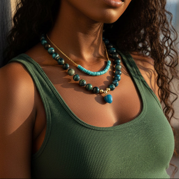 Beaded necklace with blue and green stones on a black model