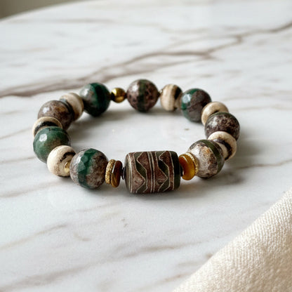 Beaded bracelet with natural stone beads on a white background