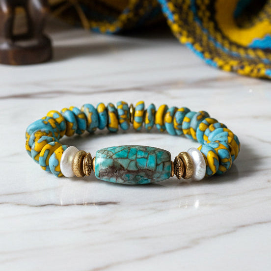 Bracelet with blue and yellow beads on a white background